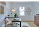 Bright office space with a modern black desk, neutral decor, wood floors, and ample natural light at 316 11Th N Ave, St Petersburg, FL 33701