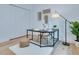 Neutral-toned office space with desk, storage, and decor, featuring wood floors and a minimalist aesthetic at 316 11Th N Ave, St Petersburg, FL 33701