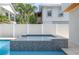 The pool's spa has mosaic tile and is surrounded by a privacy fence at 316 11Th N Ave, St Petersburg, FL 33701