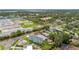 Charming aerial view of two-story home surrounded by lush greenery and a vibrant neighborhood at 4234 4Th S St, St Petersburg, FL 33705