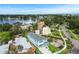 A vibrant neighborhood featuring a newly constructed home surrounded by lush greenery and waterfront views at 4234 4Th S St, St Petersburg, FL 33705