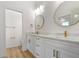 Bathroom features double vanity with marble countertop and gold fixtures at 4234 4Th S St, St Petersburg, FL 33705
