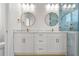 Bathroom features double vanity, marble countertops, and enclosed shower at 4234 4Th S St, St Petersburg, FL 33705