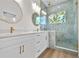 Bathroom features double vanity, marble countertops, and enclosed shower at 4234 4Th S St, St Petersburg, FL 33705