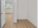 Bedroom with wood-look floors, base trim, and bright natural light at 4234 4Th S St, St Petersburg, FL 33705