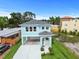A newly constructed two-story home with modern finishes and a well-manicured lawn at 4234 4Th S St, St Petersburg, FL 33705