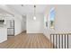 Open floor plan living area featuring hardwood floors, recessed lighting, and a modern chandelier at 4234 4Th S St, St Petersburg, FL 33705