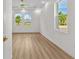 Living room with wood-look floors, recessed lighting, and fan at 4234 4Th S St, St Petersburg, FL 33705