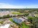 Picture of the back of a beautiful light blue single Gathering home with a green lawn. A great place to call home at 4234 4Th S St, St Petersburg, FL 33705