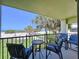 Inviting balcony featuring comfortable seating and a stunning view of the beach at 7532 Bayshore Dr # 205, Treasure Island, FL 33706