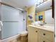 Bathroom with walk in shower, neutral vanity, and decorative art at 7532 Bayshore Dr # 205, Treasure Island, FL 33706