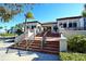 Elegant building exterior with welcoming entrance and stairs at 7532 Bayshore Dr # 205, Treasure Island, FL 33706