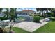 Inviting community gathering space with a gazebo, picnic tables, and lounge chairs surrounded by green lawns at 7532 Bayshore Dr # 205, Treasure Island, FL 33706
