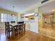 Cozy dining area connecting to the kitchen, with open view to the hallway and adjacent rooms at 7532 Bayshore Dr # 205, Treasure Island, FL 33706