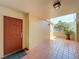 Inviting entrance with tiled flooring and a neutral color scheme, next to a potted plant at 7532 Bayshore Dr # 205, Treasure Island, FL 33706