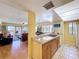 Bright kitchen with stainless steel sink, open to the living area with balcony access and ocean views at 7532 Bayshore Dr # 205, Treasure Island, FL 33706