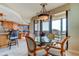 Condo dining area with kitchen access and balcony view at 3820 Gulf Blvd # 608, St Pete Beach, FL 33706