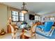 Elegant dining area with glass table and comfortable seating at 3820 Gulf Blvd # 608, St Pete Beach, FL 33706