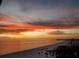 Orange sunset over the ocean and beach at 3820 Gulf Blvd # 608, St Pete Beach, FL 33706
