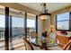 Condo dining area with balcony access and city views at 3820 Gulf Blvd # 608, St Pete Beach, FL 33706
