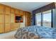 Spacious bedroom with built-in wooden cabinets and a view at 3820 Gulf Blvd # 608, St Pete Beach, FL 33706