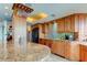 Large kitchen island with granite countertop and breakfast bar seating at 3820 Gulf Blvd # 608, St Pete Beach, FL 33706