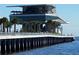 Modern pier extending over the water with a rooftop restaurant at 3820 Gulf Blvd # 608, St Pete Beach, FL 33706