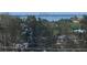 Scenic waterfront view with lush greenery and distant cityscape at 3820 Gulf Blvd # 608, St Pete Beach, FL 33706