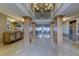 Elegant condo lobby with high ceilings and chandelier at 3820 Gulf Blvd # 608, St Pete Beach, FL 33706