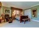 Spacious bedroom with plush carpet and a relaxing sitting area at 3820 Gulf Blvd # 608, St Pete Beach, FL 33706