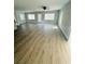 Open living space with light gray flooring and multiple windows at 1919 21St S St, St Petersburg, FL 33712