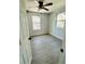 Spacious bedroom with ceiling fan and two windows at 1919 21St S St, St Petersburg, FL 33712