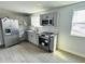 Modern kitchen with gray cabinets and stainless steel appliances at 1919 21St S St, St Petersburg, FL 33712