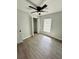 Well-lit bedroom with ceiling fan and vinyl plank flooring at 1919 21St S St, St Petersburg, FL 33712