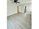 Spacious bedroom with ceiling fan and vinyl plank flooring at 1919 21St S St, St Petersburg, FL 33712