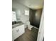 Modern bathroom with grey tile shower and granite countertop at 1919 21St S St, St Petersburg, FL 33712