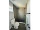 Clean bathroom with grey tile shower and toilet at 1919 21St S St, St Petersburg, FL 33712