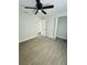 Spacious bedroom with ceiling fan and access to a closet at 1919 21St S St, St Petersburg, FL 33712
