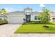 One-story house with landscaping and two-car garage at 319 Whistler Gln, Bradenton, FL 34212