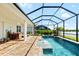 Screened pool and spa with a water feature; lake view at 319 Whistler Gln, Bradenton, FL 34212