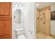 Bathroom features a shower stall with tile surround and an oval mirror at 2504 High Oaks Ln, Lutz, FL 33559