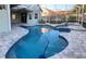 Freeform pool with spa and screened enclosure at 2733 Mcnair Dr, Palm Harbor, FL 34683