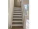 Indoor staircase with neutral color palette and simple design at 2733 Mcnair Dr, Palm Harbor, FL 34683