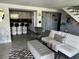 Modern living room showcasing open floor plan, stylish seating, and a view into the contemporary kitchen area at 4438 58Th N Ave, St Petersburg, FL 33714