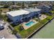This waterfront duplex features a shared in-ground pool and backyard at 800 Madonna Blvd # B, Tierra Verde, FL 33715