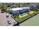 This waterfront duplex features a shared in-ground pool and backyard with water views at 800 Madonna Blvd # B, Tierra Verde, FL 33715