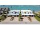 Waterfront duplex featuring driveways, chimneys, lush landscaping and gorgeous water views at 800 Madonna Blvd # B, Tierra Verde, FL 33715