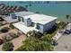 Waterfront duplex featuring driveways, chimneys, lush landscaping and gorgeous water views at 800 Madonna Blvd # B, Tierra Verde, FL 33715