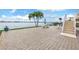 Large brick patio overlooking the water with outdoor seating at 800 Madonna Blvd # B, Tierra Verde, FL 33715
