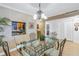 Dining room with a glass table and kitchen view at 800 Madonna Blvd # B, Tierra Verde, FL 33715